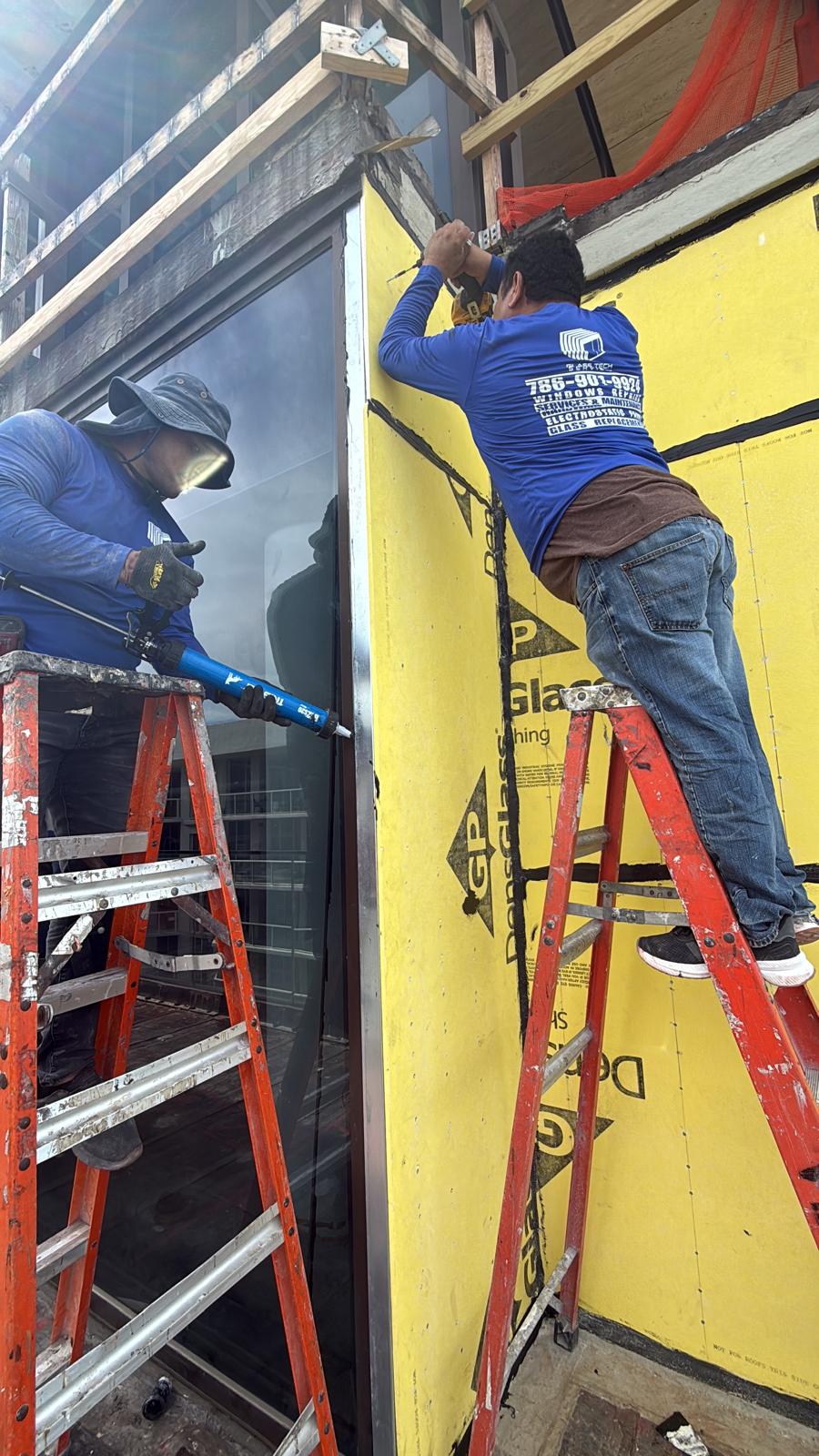 24/7 COTO team member working on an exterior wall